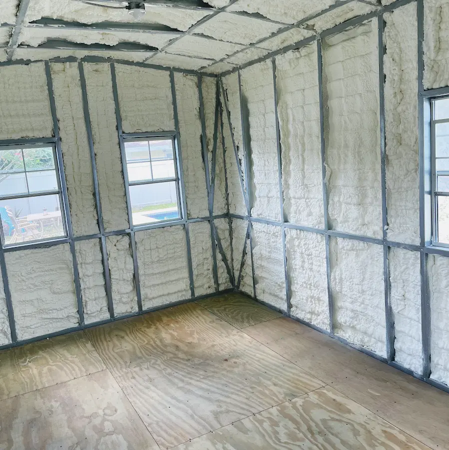 Closed-cell spray foam insulation applied to wall cavities in a residential project in Norman